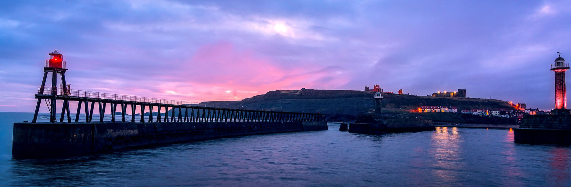 Piers across the sea at dusk in Yorkshire