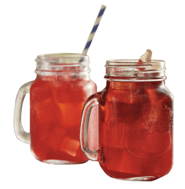 Two mason jars with handles filled with red drink and striped straw