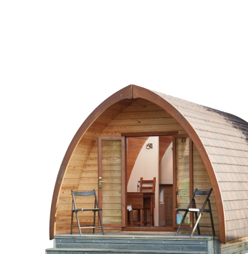 Wooden glamping pod with doors open