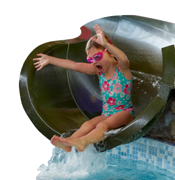 Little girl at the end of a water slide wearing blue swimming costume and pink goggles