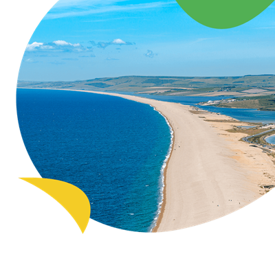 An aerial view over Chesil Beach stretching out for miles along the Dorset Coast