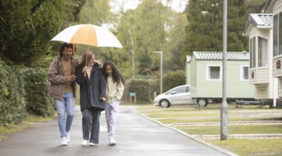 A family walking on a holiday park