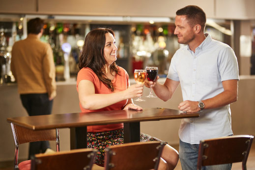 couple having a glass of wine at a bar