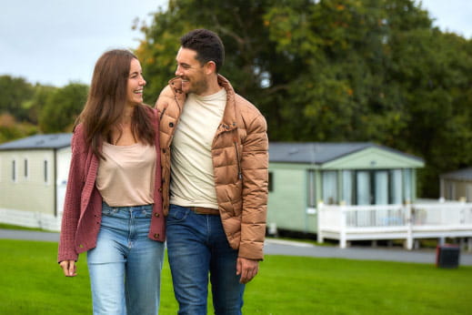 couple laughing together at a caravan park