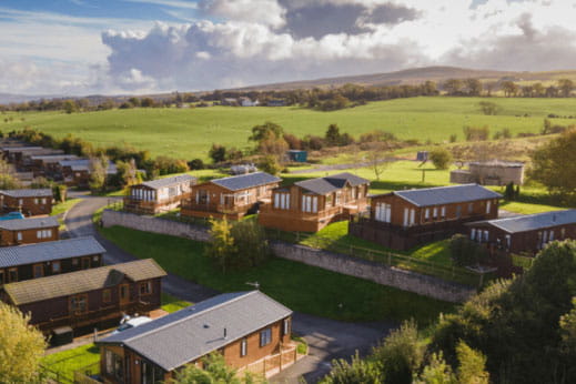 An aerial view of lodges for sale in the countryside