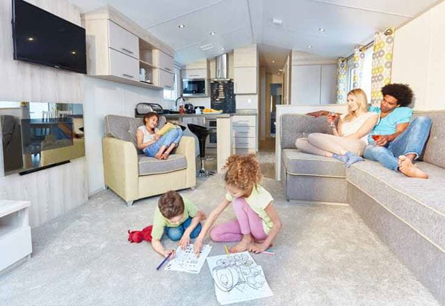 A family relaxing on holiday in a caravan