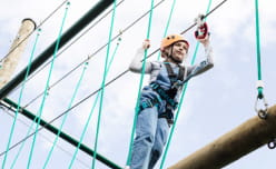 Girl climbing on ropes