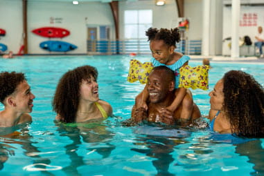 a family in a swimming pool