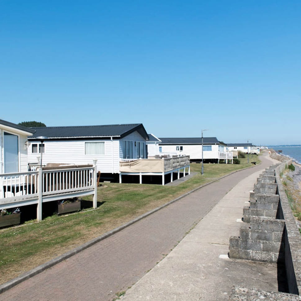 Caravans overlooking the seafront at Coopers Beach Holiday Park