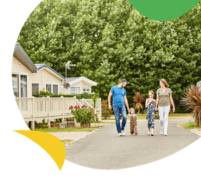 A family walking through holiday accommodation at Highfield Grange Holiday Park