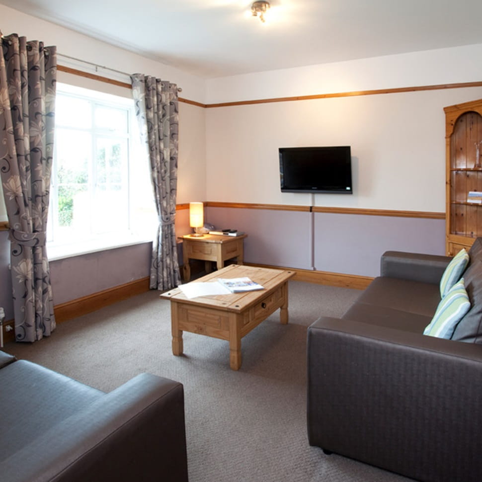 Cottage living room at Ruda Holiday Park