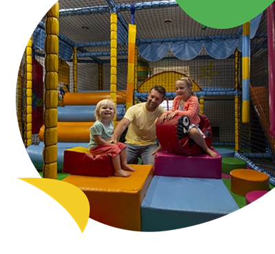 Father and kids in soft play area