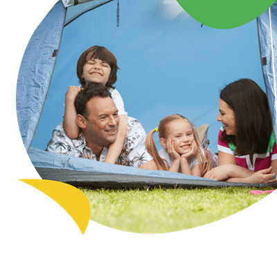 A family in a camping tent at West Bay Holiday Park