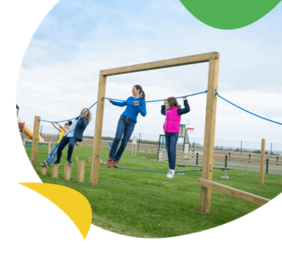 Children on a rope course on the outdoor play area at Whitley Bay Holiday Park
