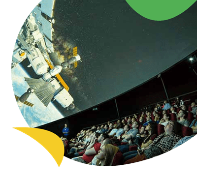 An audience watching an impressive space cinema at the Life Science Centre near Whitley Bay Holiday Park