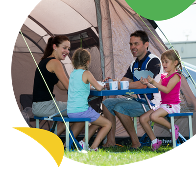 A family sat at a table in their tent at Withernsea Sands Holiday Park