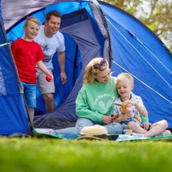 family outside tent