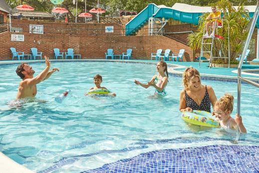family in outdoor swimming pool