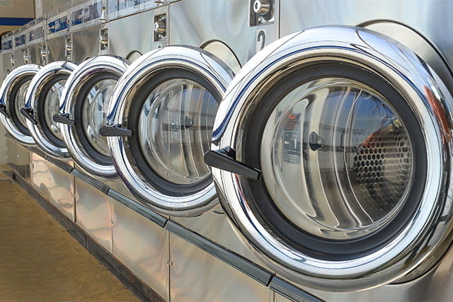 A row of washing machines in a laundrette